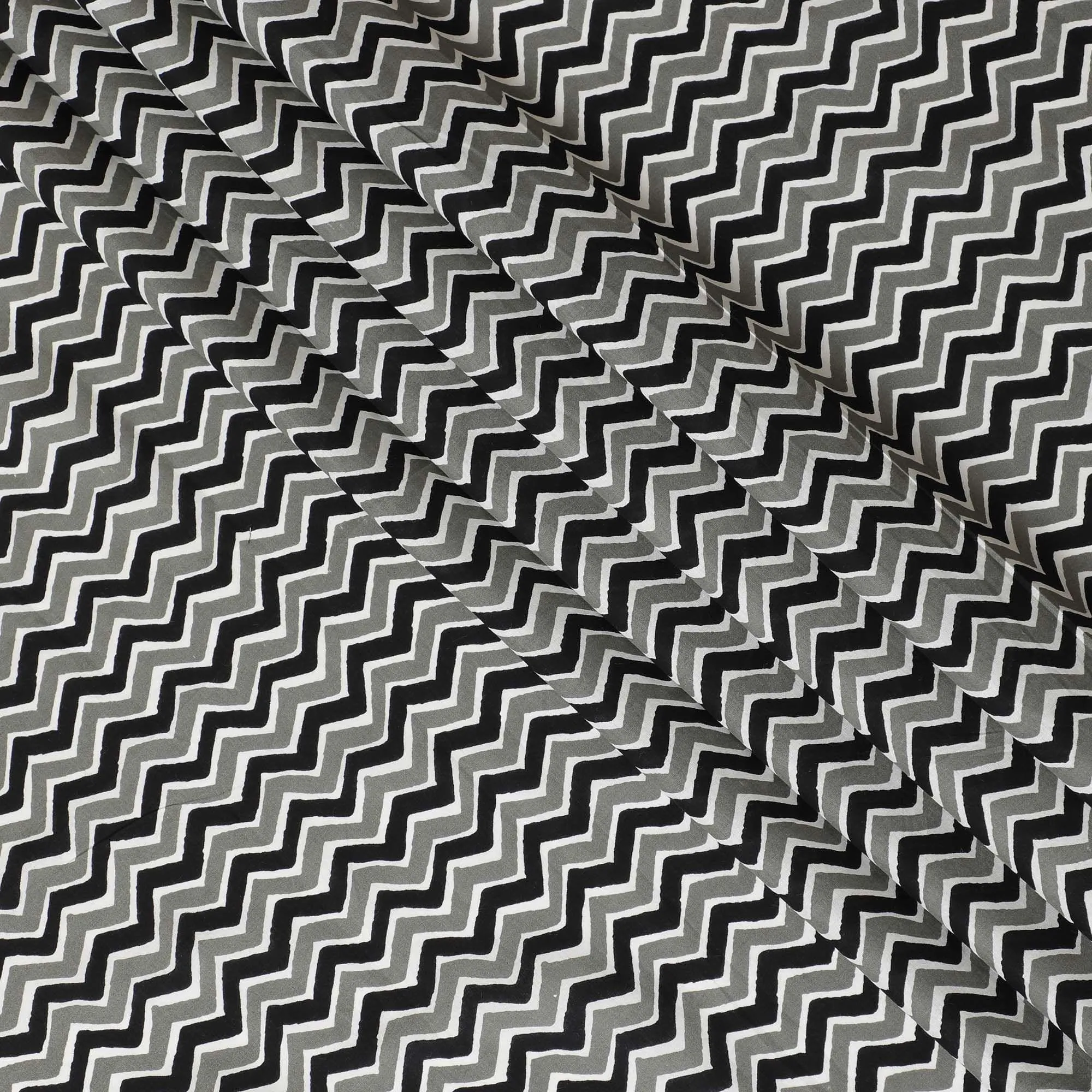 White organic cotton fabric with black, off white and sage green screen block print in abstract design-D10286